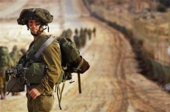 In this photo released by the Israeli army, Israeli soldiers walk towards the northern Gaza Strip as seen from the Israeli border with Gaza, Monday, Jan. 12, 2009. Israeli ground troops battled Palestinian militants in the streets of a densely populated Gaza City neighborhood early Tuesday, destroying dozens of homes and sending terrified residents running for cover as gunfire and explosions echoed in the distance.(AP Photo/IDF, Neil Cohen, HO)