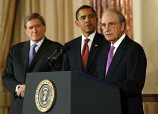 US President Barack Obama listens alongside Richard Holbrooke (L), newly named Special Envoy to Afghanistan and Pakistan, as George Mitchell (R), newly named Special Envoy to the Middle East, speaks at the State Department in Washington, DC.(AFP/Saul Loeb)