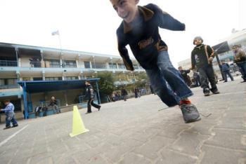 Gaza children have physical exercise class in the Beit Loliya Boys Elementary School in Gaza city Jan. 24, 2009. Some 200,000 Gaza children returned to school for the first time since Israel‘s offensive. (Xinhua/Zhang Ning)