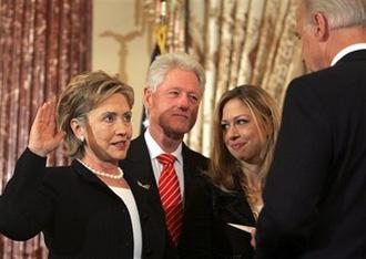 Vice President Joe Biden, right, swears in Secretary of State Hillary Rodham Clinton in a ceremonial swearing-in at the Sate Department, Monday, Feb. 2, 2009, in Washington. (AP Photo/Lawrence Jackson)