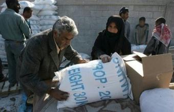 A Palestinian man carries a bag of food aid from the United Nations Relief and Works Agency (UNRWA) at the refugee camp of Rafah, January 2008. The UN agency for Palestinian refugees UNRWA said that the Islamist Hamas rulers of the Gaza Strip have returned aid supplies they seized last week.(AFP/File/Said Khatib)