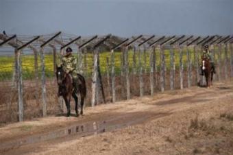 Indian Border Security Force soldiers patrol by horseback at the western sector of the India-Pakistan International Border Post at the village Hindu Malkot, in January. Senior US diplomat Richard Holbrooke was set for talks with Indian leaders on Monday expected to focus on the global threat from Pakistan-based militants in the wake of the Mumbai attacks.(AFP/File)