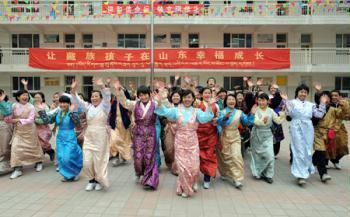 Tibetan students celebrate the Tibetan New Year which falls on Feb. 25 this year at Jinan Tibetan School in Jinan, capital of east China's Shandong Province, Feb. 24, 2009. Some 200 Tibetan students who study in the coastal province welcomed Tibetan New Year on Tuesday.(Xinhua/Fan Changguo)