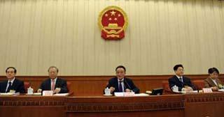 Wu Bangguo (C), chairman of the Standing Committee of the National People's Congress (NPC), presides over the concluding meeting of the 7th meeting of the 11th NPC Standing Committee in Beijing, on Feb. 28, 2009. The NPC Standing Committee, China's top legislature, concluded its four-day session on Saturday, after approving the food safety law, an amendment to the criminal law and the revised insurance law. (Xinhua photo)