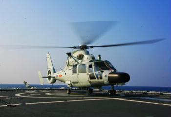 Helicopter conducts a takeoff and landing training on China's destroyer 