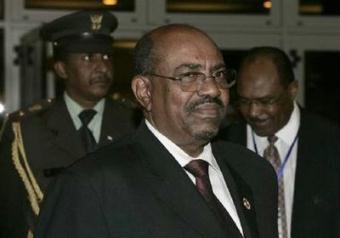 Sudanese President Omar Hassan al-Bashir (C) leaves after a closed-door session at the 12th African Union Summit in Ethiopia's capital Addis Ababa February 4, 2009.REUTERS/Antony Njuguna