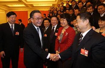 Wu Bangguo (front L), member of the Standing Committee of the Political Bureau of the Communist Party of China (CPC) Central Committee and also chairman of the Standing Committee of the National People's Congress (NPC), attends the panel discussion of deputies to the Second Session of the 11th NPC from east China's Shandong Province, in Beijing, capital of China, March 7, 2009. (Xinhua/Yao Dawei)