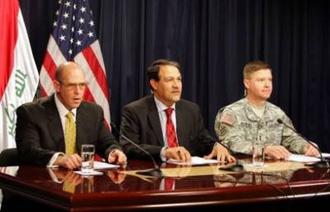 Iraqi government spokesman Ali Dabbagh (centre) answers questions during a joint press conference with Major General David Perkins (right) and US diplomat Adam Erelly in Baghdad.(AFP/Sabah Arar)