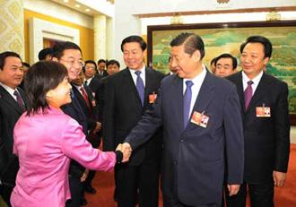 Chinese Vice President Xi Jinping (front R), who is also a member of the Standing Committee of the Political Bureau of the Communist Party of China (CPC) Central Committee, joins a panel discussion with deputies to the Second Session of the 11th National People's Congress (NPC) from north China's Shanxi Province, in Beijing, capital of China, March 10, 2009.(Xinhua Photo)