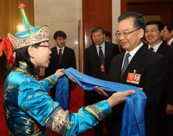 Chinese Premier Wen Jiabao (front R) joins a panel discussion with deputies to the Second Session of the 11th National People's Congress (NPC) from north China's Inner Mongolia Autonomous Region, in Beijing, capital of China, March 10, 2009. (Xinhua/Lan Hongguang)