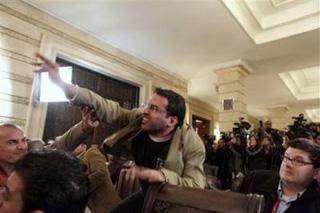 In this Dec. 14, 2008 file photo, Iraqi journalist Muntadhar al-Zeidi throws a shoe at President George W. Bush during a new conference with Iraq Prime Minister Nouri al-Maliki in Baghdad, Iraq.(AP Photo/Evan Vucci, File)