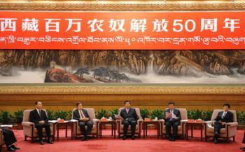 Jia Qinglin (C), chairman of the National Committee of the Chinese People's Political Consultative Conference (CPPCC), attends the symposium marking the 50th anniversary of serfs emancipation in Tibet held in Beijing, capital of China, on March 27, 2009.(Xinhua/Li Xueren)