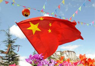 A Chinese national flag flicks at the square in front of Potala Palace in Lhasa, capital of southwest China's Tibet Autonomous Region, March 26, 2009. A grand celebration ceremony will be held here at 10:00 a.m. local time on March 28 to mark the first Serfs Emancipation Day.(Xinhua/Chogo)