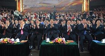 Jia Qinglin, a member of the Standing Committee of the Political Bureau of the Communist Party of China (CPC) Central Committee and chairman of the National Committee of the Chinese People's Political Consultative Conference, and Zhou Yongkang, a member of the Standing Committee of the Political Bureau of the CPC Central Committee and head of the Central Political Science and Law Commission (CPSLC) of the CPC, watch a gala together with nearly one thousand audience to celebrate the 50th anniversary of the emancipation of Tibetan serfs in Beijing, capital of China, March 28, 2009. (Xinhua/Fan Rujun)