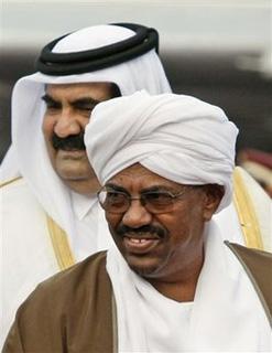 Sudanese President Omar al-Bashir, foreground, is accompanied by Qatari Emir Sheik Hamad Bin Khalifa Al Thani, background, upon his arrival at Doha airport, Qatar, Sunday, March 29, 2009 for an Arab summit meeting.(AP Photo/Hassan Ammarl)