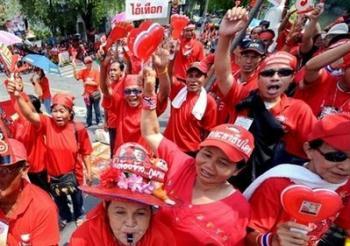 Supporters of Thailand's ousted premier Thaksin Shinawatra shout slogans during a demonstration at the Government House in Bangkok. Anti-government protesters attacked Thai Prime Minister Abhisit Vejjajiva's car and trapped him inside a beach hotel Tuesday as the kingdom's political turmoil boiled over into violence.(AFP/Pornchai Kittiwongsakul) 