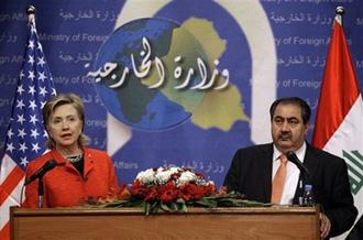 U.S. Secretary of State Hillary Rodham Clinton, left, and Iraqi Foreign Minister Hoshyar Zebari, address the media at a press conference in Baghdad, Iraq, Saturday, April 25, 2009.(AP Photo/Hadi Mizban, Pool)