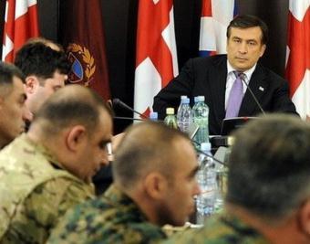 Georgian President Mikheil Saakashvili holds a meeting with Defence Ministry staff in Tbilisi. NATO kicked off controversial military exercises in ex-Soviet Georgia on Wednesday as tensions spiked in relations with Russia over Moscow's expulsion of two alliance diplomats.(AFP/POOL/Irakli Gedenidze)