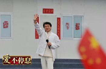 The 55-year-old star, best-known for his martial arts films, came to Beichuan Middle School, one of the worst-hit schools in the quake, to sing a song titled "Nation" with students there. 