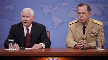 Defense Secretary Robert Gates, left, accompanied by Joint Chiefs Chairman Adm. Michael Mullen, right, meets reporters at the Pentagon, Monday, May 11, 2009.(AP Photo/Pablo Martinez Monsivais)