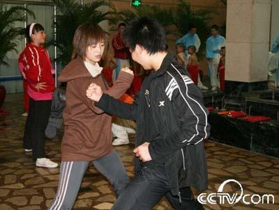 Actors practice "fight" with each other