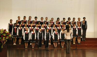 Students present singing performance.