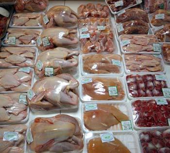 Packages of chicken are sold at a market in Beijing, capital of China, Jan. 8, 2009. (Xinhua Photo)