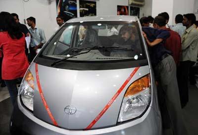 The newly-released Nano -- the world's cheapest car -- pictured at the Tata auto-maker's plant at Pimpri near Mumbai. The Nano went on sale on Thursday, with dealers and the company behind it confident of strong demand despite a slump in global car sales amid the world economic downturn.(Xinhua/AFP Photo)