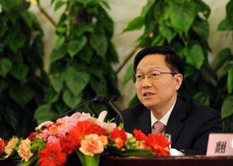 Xie Xuren, Minister of China's Finance Ministry, answers questions during a press conference on the sidelines of the 2nd session of the 11th NPC in Beijing, March 6, 2009. [Xinhua]