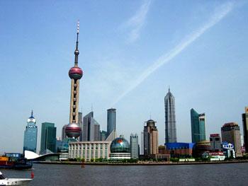 Analyst believe the creation of Shanghai as an international financial hub will get a big boost from the RMB settlement scheme.