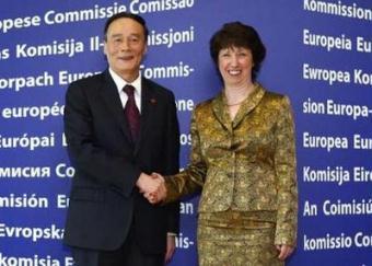 China's Vice-Premier Wang Qishan (L) is welcomed by European Union Trade Commissioner Catherine Ashton (R) at the European Commission headquarters in Brussels May 7, 2009. The Chinese delegation attended a second high-level dialogue on trade and economic issues with the EU.REUTERS/Yves Herman