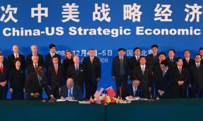 Chinese Vice Premier Wang Qishan (front R) and U.S. Treasury Secretary Henry Paulson attend the signing ceremony on energy and environmental protection cooperation during the fifth China-U.S. Strategic Economic Dialogue in Beijing, China, Dec. 4, 2008.(Xinhua/Pang Xinglei)