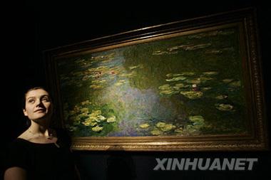 A Monet water-lily painting sold for a record 41 million pounds on Tuesday, easily surpassing the previous auction record for a Monet work.