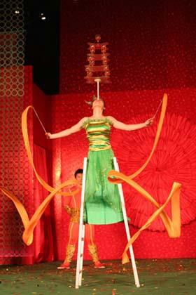 Acrobats from southeast China's Fujian Province perform during the Chinese Culture and Travel exhibition in Singapore, on Jan. 2, 2009. An exhibition introducing Chinese culture, artworks and travel was held at Raffles City Shopping Center in Singapore on Friday.  (Xinhua Photo)