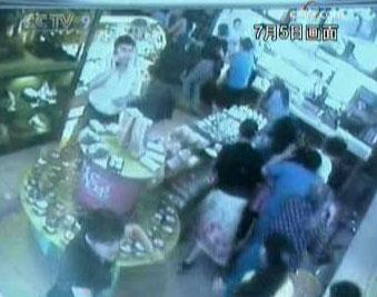 Surveillance footage taken during the riots, shows employees of a bakery providing shelter for people.