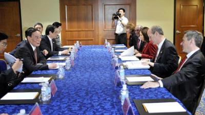 Chinese Vice Premier Wang Qishan (L2) meets with U.S. Congressmen in Washington, D.C., on July 26, 2009, the day before the first round of the China-U.S. Economic and Strategic Dialogue, which is to be held in Washington, D.C. from July 27 to 28. (Xinhua/Zhang Yan) 