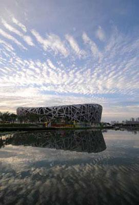 The photo taken on Aug. 1, 2008 shows the National Stadium, namely the Bird's The photo taken on Aug. 1, 2008 shows the National Stadium, namely the Bird's Nest, standing with its reflection image under the blue sky in Beijing, capital of China. [Xinhua]