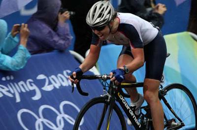 Britain's Nicole Cooke is excited after passing the finish line during women’s cycling road race of the Beijing 2008 Olympic Games in Beijing, China, August 10, 2008. Nicole Cooke won gold in the event(Xinhua Photo)