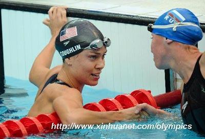 Natalie Coughlin (L) of the United States receives congratulation from Russia's Anastasia Zueva after the final of women's 100m backstroke at the Beijing 2008 Olympic Games in the National Aquatics Center, also known as the Water Cube in Beijing, China, Aug. 12, 2008. Natalie Coughlin claimed the title with 58.96 seconds. (Xinhua)