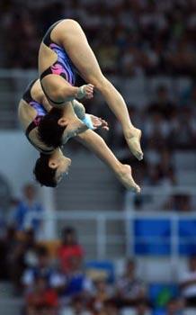 China's Chen Ruolin (front)/Wang Xin compete during the women's synchronized 10m platform at the Beijing 2008 Olympic Games in the National Aquatics Center, also known as the Water Cube in Beijing, China, Aug. 12, 2008. Chen Ruolin/Wang Xin won the gold medal in the event with a score of 363.54 points. (Xinhua/Liu Yu) 