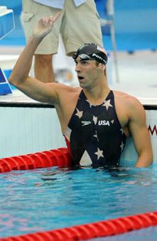 Michael Phelps of the United States celebrates after winning the men's 200m freestyle final at the Beijing 2008 Olympic Games in the National Aquatics Center, also known as the Water Cube in Beijing, China, Aug. 12, 2008. Phelps set a new world record and won the gold medal in the event with 1 minute 42.96 seconds.(Xinhua/Wang Dingchang)