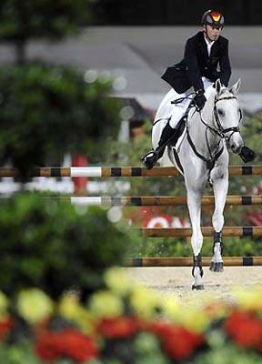 German rider Hinrich Romeike and horse Marius jump during eventing jumping competition of the Beijing 2008 Olympic Games equestrian events at Hong Kong Olympic Equestrian Venue (Sha Tin) in the Olympic co-host city of Hong Kong, south China, Aug. 12, 2008. Germany won the first Olympic Eventing Team gold medal in the three-day eventing here Tuesday night with a total penalty of 166.10. (Xinhua/Lui Siu Wai)