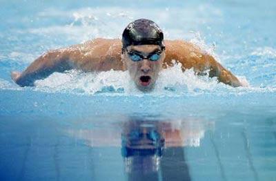 Michael Phelps of the United States swims during the men's 200m butterfly final at the Beijing 2008 Olympic Games in the National Aquatics Center, also known as the Water Cube in Beijing, China, Aug. 13, 2008. Phelps set a new wolrd record and won the gold medal in the event with 1 minute 52.03 seconds. (Xinhua)