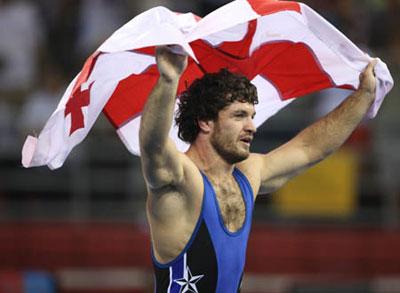 Manuchar Kvirkelia of Georgia celebrates during the men's Greco-Roman 74kg final of wrestling against Chang Yongxiang of China at Beijing 2008 Olympic Games in Beijing, China, Aug. 13, 2008. Manuchar Kvirkelia of Georgia won the gold medal in the match. (Xinhua/Lu Mingxiang)