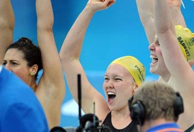 Australian team celebrate after they won the women's 4x200m freestyle relay gold in the National Aquatics Center, also known as the Water Cube in Beijing, China, Aug. 14, 2008. (Xinhua Photo)