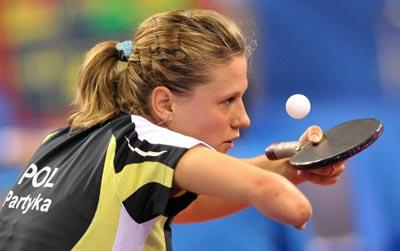 Poland's Natalia Partyka serves against Hong Kong's Tie Yana during the women's team group D table tennis competition at the 2008 Beijing Olympic Games on August 13, 2008.[Agencies]