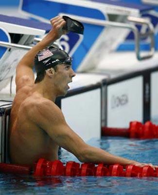 Michael Phelps of the United States celebrates after winning the men's 200m individual medley final at the Beijing 2008 Olympic Games in the National Aquatics Center, also known as the Water Cube in Beijing, China, Aug. 15, 2008. Phelps set a new world record and won the gold medal in the event with 1 minute 54.23 seconds. (Xinhua/Ding Xu)