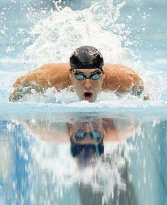 Michael Phelps of the United States swims during the men's 200m individual medley final at the Beijing 2008 Olympic Games in the National Aquatics Center, also known as the Water Cube in Beijing, China, Aug. 15, 2008. Phelps set a new world record and won the gold medal in the event with 1 minute 54.23 seconds. (Xinhua/Fan Jun)