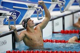 Ryan Lochte of the United States celebrates after winning the men's 200m backstroke final at the Beijing 2008 Olympic Games in the National Aquatics Center, also known as the Water Cube in Beijing, China, Aug. 15, 2008. Lochte set a new world record and won the gold medal in the event in a time of 1 minute 53.94 seconds. (Xinhua/Ding Xu)