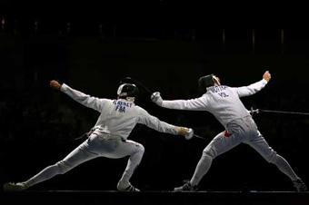 Jerome Jeannet of France hits Tomasz Motyka of Poland.